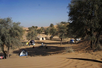 Base camp with Bedu mess tent and individual dome tents for people to sleep in