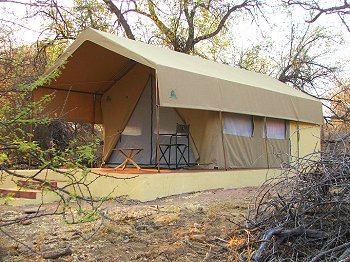 Safari tent. The walled area at the back contains a shower & toilet.