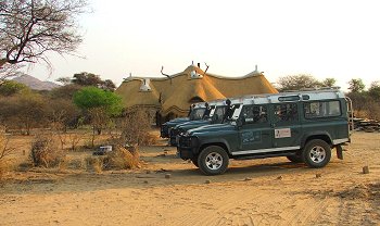 Lapa with Land Rover expedition fleet in front.