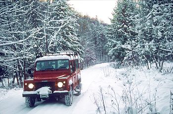 Land Rover on its way to a drop-off point in the forest