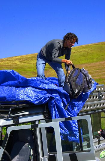 Unpacking the Land Rover near the mountain hut base