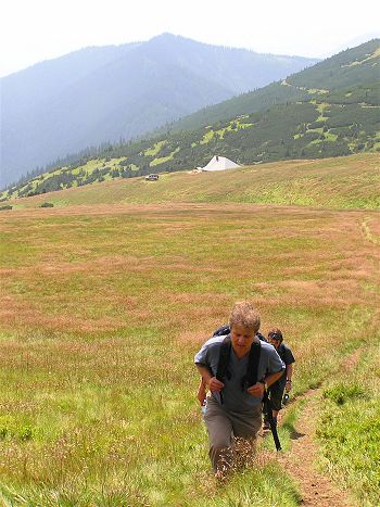Climbing up to the main ridge. Mountain hut base and Land Rover in the background.